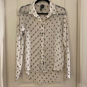 Fun & Flirt white button-up blouse with black skulls. Medium